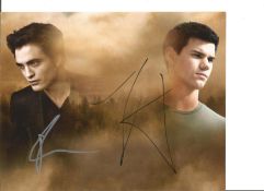 Twilight two 10 x 8 colour photos signed by Robert Pattinson and Taylour Lautner. All autographs are