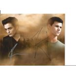 Twilight two 10 x 8 colour photos signed by Robert Pattinson and Taylour Lautner. All autographs are