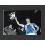 Mike Doyle signed 14x11 mounted colourised photo pictured during his playing days with Manchester