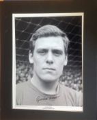 Gordon West signed 20x16 mounted black and white photo pictured during his playing days for