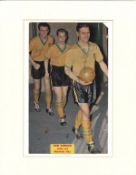 Ron Ashman signed 14x11 mounted colour magazine photo pictured leading Norwich City out. Ronald