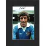 Tommy Booth signed 16x12 overall mounted colour photo pictured during his playing days with