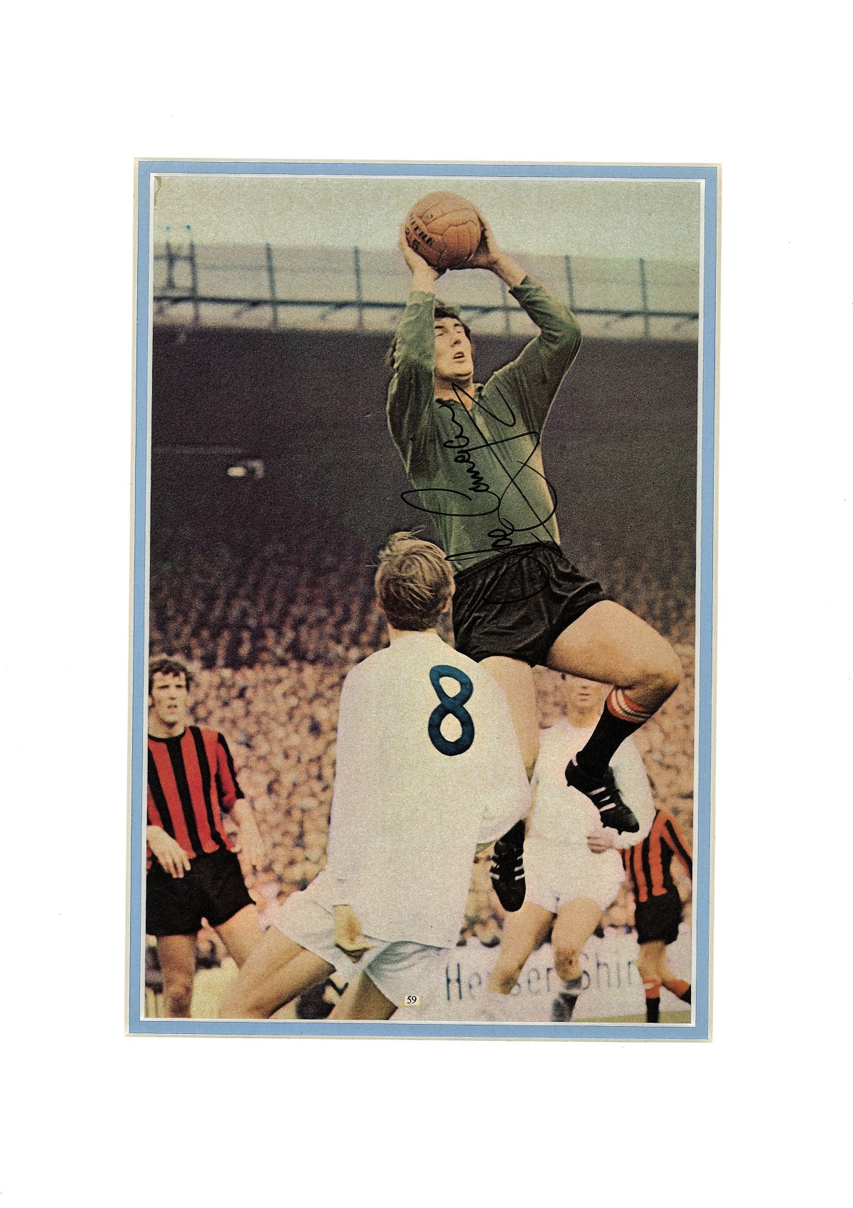 Joe Corrigan signed 16x12 overall mounted colour magazine photo pictured in action for Manchester