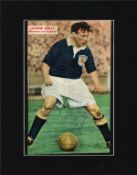 Lawrie Reilly signed 14x11 mounted colour magazine photo pictured in action for Scotland. Lawrence