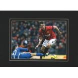 Phil Jones signed 16x12 mounted colour photo pictured in action for Manchester United. Philip