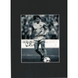 Asa Hartford signed 16x12 overall mounted black and white photo pictured in action for Manchester