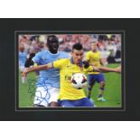 Yaya Toure signed 16x12 overall mounted colour photo pictured in action for Manchester City. Touré