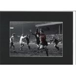 Mike Doyle signed 16x12 overall mounted colourised photo pictured in action for Manchester City.