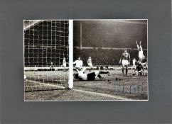 Colin Bell signed 16x12 overall mounted black and white photo pictured in action for England against