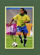 Ronaldinho signed 16x12 mounted colour photo pictured in action for Brazil. Ronaldo de Assis Moreira
