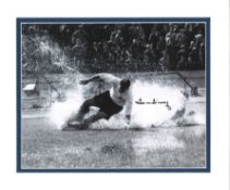 Tom Finney signed 12x10 mounted black and white photo picturing the iconic splash down image.
