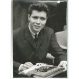 Cliff Richard signed 12 x 8 inch b/w young photo. Good Condition. All autographs are genuine hand