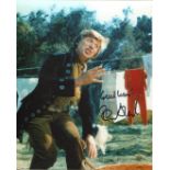 Entertainer Tommy Steel signed 8x10 movie scene photo. Good Condition. All autographs are genuine