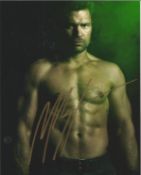 Blowout Sale! Arrow Manu Bennett hand signed 10x8 photo. This beautiful hand-signed photo depicts