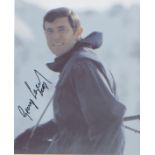 James Bond George Lazenby signed 10 x 8 inch photo in character as Bond. Good Condition. All