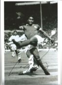Eusebio football legend signed 12 x 8 inch b/w action photo. Good Condition. All autographs are