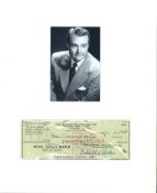 Red Skelton signed cheque, mounted below small b/w photo. Approx overall size 14x12. (July 18,
