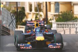 Sebastian Vettel Formula One Motor Racing driver signed 12 x 8 colour action photo, in Red Bull car.