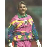 Football Neville Southall signed 10x8 colour photo pictured while playing for Wales. Good Condition.