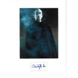 Christopher Lee signature piece mounted below colour photo. Approx overall size 16x12. Good