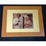 Barbara Windsor signed 10 x 8 inch colour Carry on photo with Sid James. Framed and monuted to