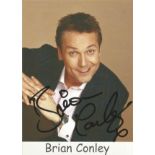 Brian Conley signed 6x4 colour promo photo. Good Condition. All autographed items are genuine hand