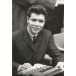 Cliff Richard signed 12 x 8 inch b/w young photo. Good Condition. All autographed items are