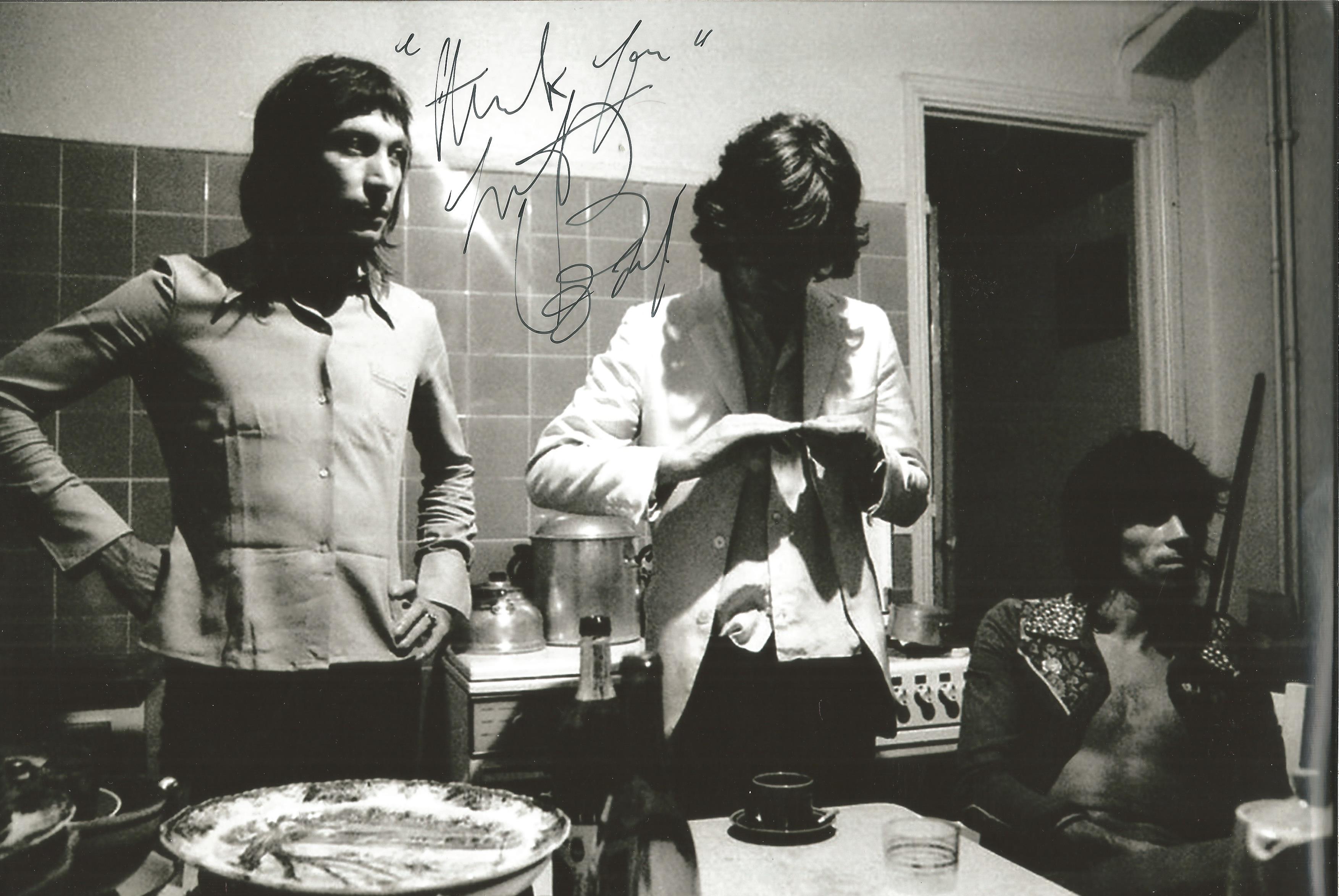 Rolling Stones Charlie Watts signed 12 x 8 inch b/w relaxed band photo in kitchen. Good Condition.