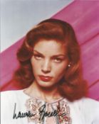 Lauren Bacall signed 10 x 8 colour portrait photo. Good Condition. All autographed items are genuine