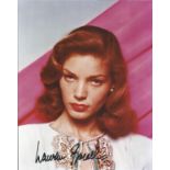 Lauren Bacall signed 10 x 8 colour portrait photo. Good Condition. All autographed items are genuine