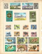 BCW stamp collection on 4 loose album pages. Includes Kenya, Uganda and Tanganyika, Malta, Malaysia,