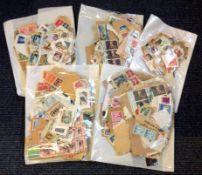 World stamp collection on backing paper. Some of value. 5 bags. Good condition. We combine postage