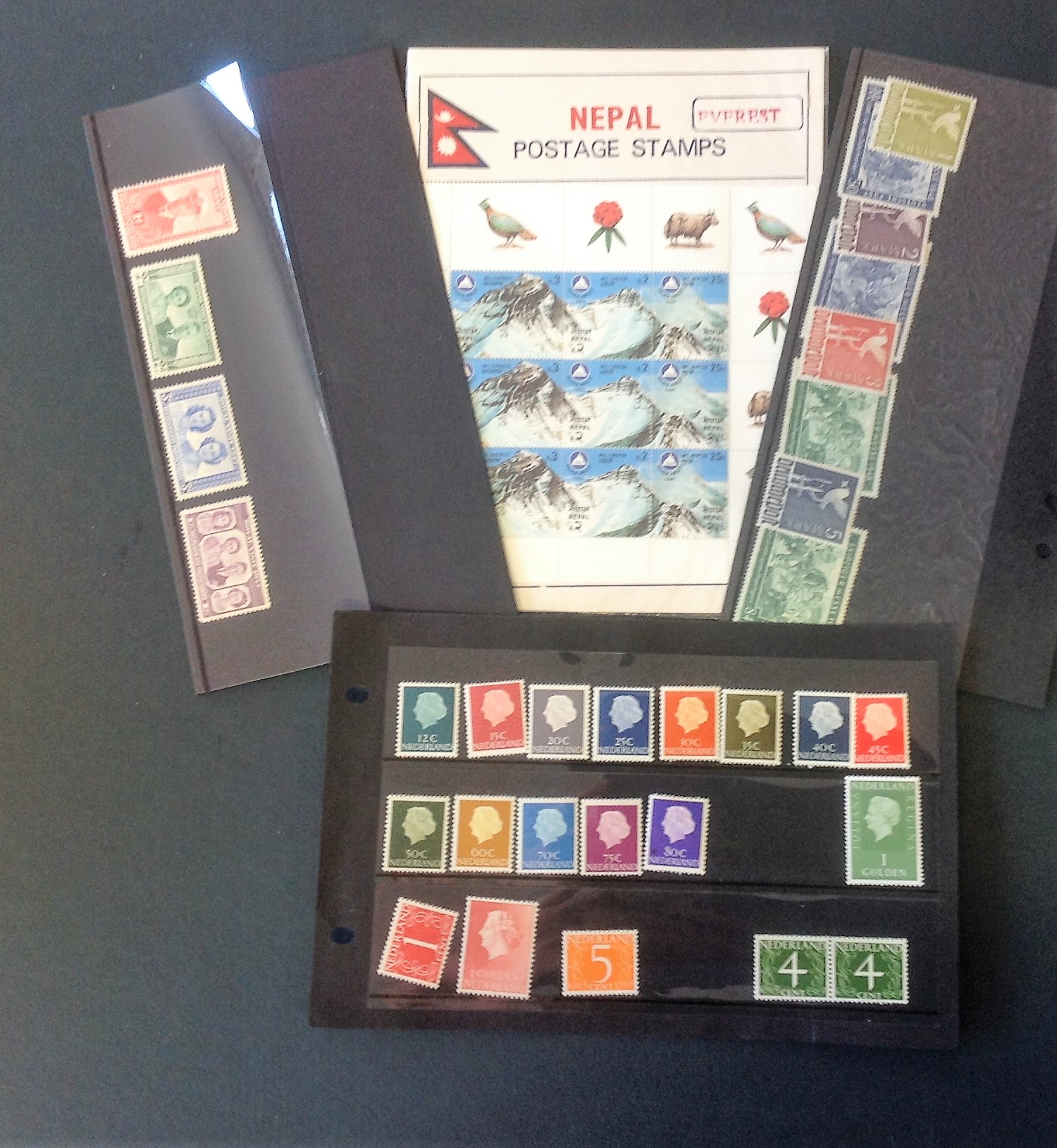 Mint stamp collection. Includes Netherlands, Germany, Bechuanaland and Nepal. Good condition. We