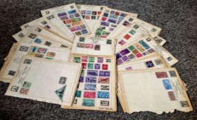 World stamp collection on 45 loose album pages. Includes USA, Japan, Iran, China and more. Good
