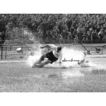 Football Tom Finney signed 16x12 black and white photo picturing his iconic splash down image.