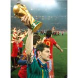 Football Iker Casillas signed 16x12 colour photo pictured with the World Cup while playing Spain.