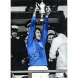 Football John Greig signed 16x12 colourised photo pictured lifting a trophy while captain of Rangers