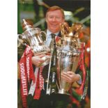 Football Alex Ferguson signed 12x8 colour photo pictured holding the FA. Cup and Premier League