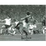 Football Lou Macari signed 10x8 black and white photo pictured in action for Manchester United. Good