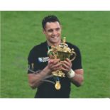 Rugby Union Dan Carter signed 10x8 colour photo pictured holding the Webb Ellis Rugby world cup