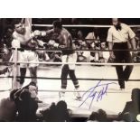 Boxing Larry Holmes signed 16x12 black and white photo pictured in his WBC world heavyweight title