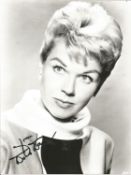 Doris Day signed 10x8 black and white photo. Good Condition. All autographed items are genuine