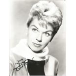 Doris Day signed 10x8 black and white photo. Good Condition. All autographed items are genuine