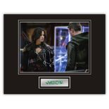 Stunning Display! Arrow Katrina Law hand signed professionally mounted display. This beautiful