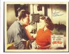 June Haver signed 11x8 colour photo of a lobby card from the 1951 movie Love Nest. Good Condition.