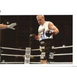 Uwe Boll signed 10 x 8 inch colour photo in boxing ring. Good Condition. All autographed items are