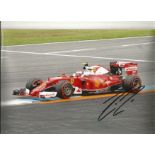 Kimi Raikkonen signed stunning Formula One Ferrari 12 x 8 inch action photo. Good Condition. All