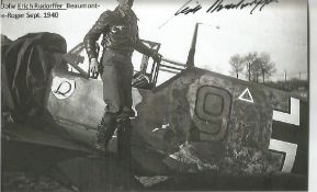 WW2 Luftwaffe ace Erich Rudorffer signed 6 x 4 inch b/w photo of him on the wing of his plane.