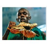 Usain Bolt Athletics Signed 16 x 12 inch sport photo. Good Condition. All autographed items are