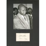 Gabon President Leon Mba signed card matted with photo to an overall size 12 x 8 inches. Good